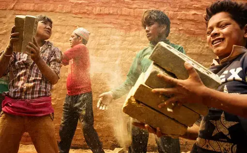 Young boys help stack bricks inside a kiln in Dhading district, Nepal. Despite a national law that bans children under the age of 14 from working, such scenes are commonplace in the country’s brick making industry. Image and caption by Ann Hermes. Nepal, 2016. Media file: tumblr_o5nug9autw1rf8lnho1_1280.jpg