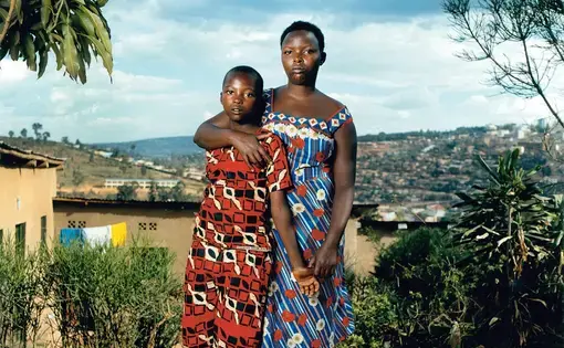 Josette, 40, and her son Thomas, 24: Josette was beaten and raped by militiamen. After the genocide, a pregnant Josette was rejected by members of her family. Thomas is now training to be a plumber  Image by Jonathan Torgovnik. Rwanda, 2019.