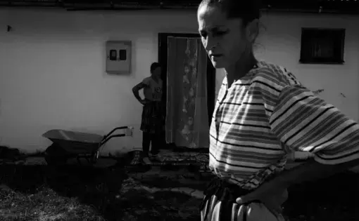 Hazira Đafič prepares to go into the woods to scavenge wood-logs, outside the Ježevac refugee camp in Banovići. Image by Jošt Franko. Bosnia and Herzegovina, undated.