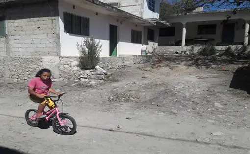 A young girl rides her bike through Coyolillo, a small town in Veracruz with a high population of Afro-Mexicans. Image by Jonathan Custodio. Mexico, 2018.
