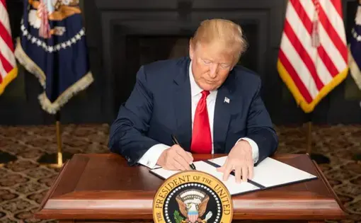 President Donald J. Trump signs an Executive Order in Bedminster, New Jersey, entitled “Reimposing Certain Sanctions with Respect to Iran.” Image courtesy of the White House.
