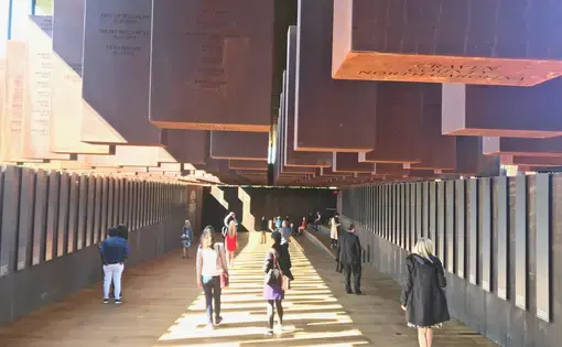 Names and dates of victims, by county, at the National Memorial for Peace and Justice in Montgomery, AL. Image by Jon Sawyer. United States, 2018. 