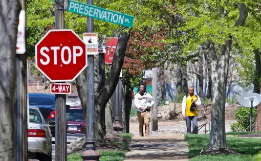 The Preservation Square neighborhood is located in the middle of the 63106 ZIP code and includes a public elementary school, an early childhood center and a convenience store, and is accessible to Metro bus routes. Nearly half the residents in 63106 do not own vehicles, and half have incomes below the poverty line. Image by Wiley Price / St. Louis American. United States, 2020.