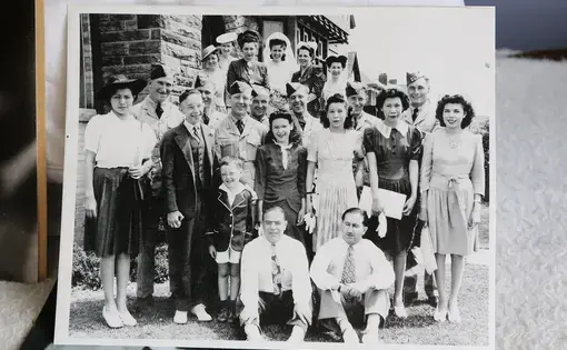 A photo of Doreen Bellaire's mother, Delina Commana (center), who attended a residential school in Spanish, Ontario for ten years. To protect her own family from ever having to go through the same experience, Delina left her reserve and moved into town to raise her children, never even telling them that they were First Nations. It wasn't until decades later that Doreen found out about her culture and her heritage. Image by Daniella Zalcman. Canada, 2015. Media file: daniellazalcman-soyi-130.jpg