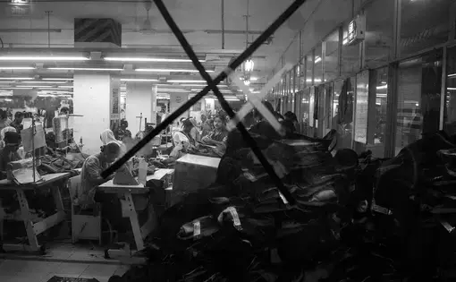 Workers are seen in a garment factory in Mirpur area in Dhaka. The factory employs 1200 workers, who mostly produce jeans and jackets. Image by Jost Franko. Bangladesh, 2016.