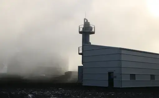 This facility near Reykjavik scrubs CO2 from geothermal steam leaving Iceland’s Hellisheiði power plant and begins the process of securing it underground, where it reacts with basalt rocks to form stable new minerals. Image by Ari Daniel. Iceland, 2019.