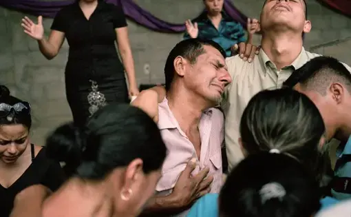 Family members mourn the death of Darwin Franco, a community organizer in Honduras. Later that evening his family received death threats. Image by Dominic Bracco II. Honduras, 2015.