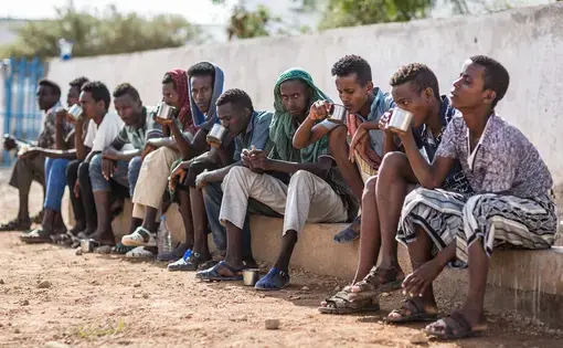 Ethiopians at the IOM transit centre in Obock, Djibouti, waiting to return home. People on the road to Obock told the Guardian that friends had perished en route. Image by Charlie Rosser. Djibouti, 2018.