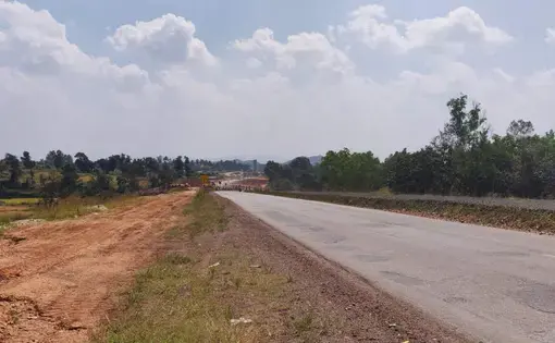 National Highway (NH)-4A connects Belgaum district in Karnataka in the east to Goa in the west. Pictured above is the four-lane section starting in Belgaum. The brown strip on the side had trees that were cleared for the widening. Image by Disha Shetty. India, undated.