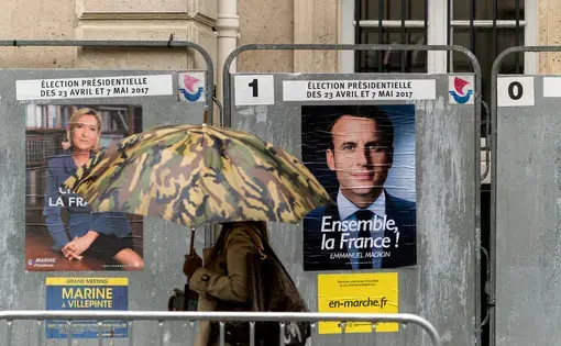Posters promoting candidates in the 2017 French presidential election, Marine Le Pen and Emmanuel Macron. Image by Lorie Shaull. France, 2017.
