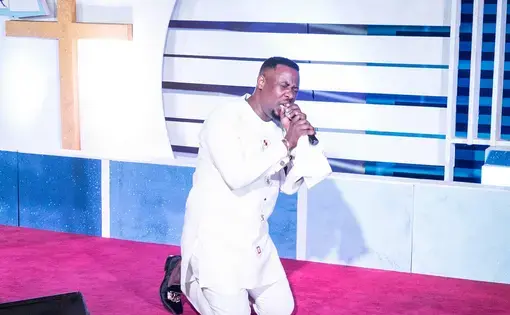 Prophet Nigel Gaise during an evening service. Gaise, a former engineer student, is openly homophobic and his faithful community is growing year after year. Image by Tomaso Clavarino. Ghana, 2018.