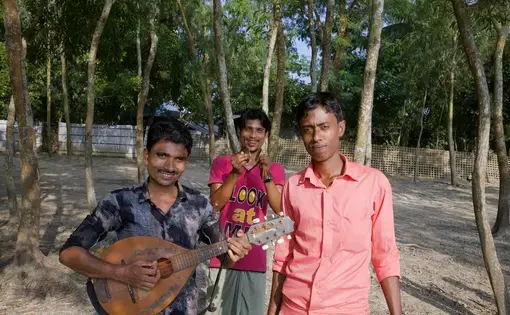 (Left to right) Siraz Ulislam, Amanullah, and Azimullah perform at social gatherings, for humanitarian organizations, and when people commission them to make songs about their lives. Image by Faiham Ebna Sharif. Bangladesh, 2019.