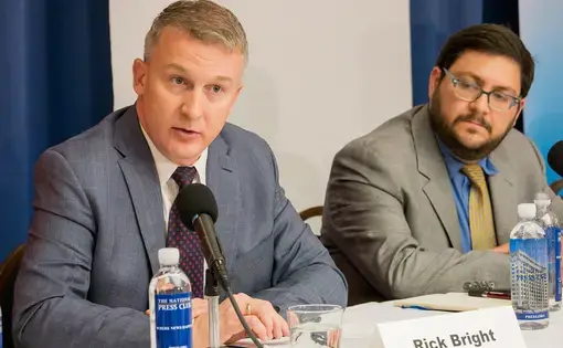 Rick Bright (left), former director of the Biomedical Advanced Research and Development Authority (BARDA), alleges in a whistleblower complaint that officials punished him for refusing to deliver funds to pharmaceutical firms run by "cronies." Image by Alliance for Health Policy / Creative Commons. United States, 2016.