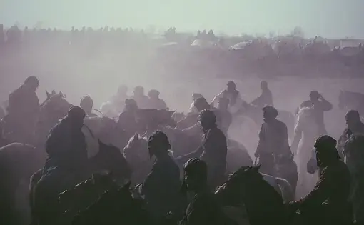Buzkashi players battle for a headless calf in northern Afghanistan. Image by Jason Motlagh. Afrghanistan, 2017.