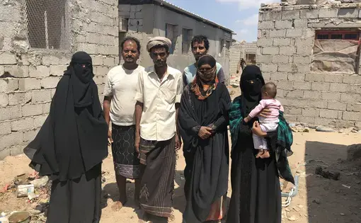 Souad and her family fled Basateen, a suburb of Aden, two months before this photo was taken. They may be safe from bombs, but they have become homeless in their own land and still face the daily threat of starvation. Image by Marcia Biggs. Yemen, 2018.