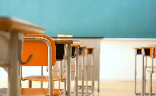 Empty desks and blackboard in a classroom. Image by maroke / Shutterstock.com. Japan, undated. Empty desks and blackboard in a classroom. Image by maroke / Shutterstock.com. Japan, undated.