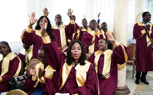 Youngsters during Sunday service at the Streams of Power church in Accra. Image by Tomaso Clavarino. Ghana, 2017.
