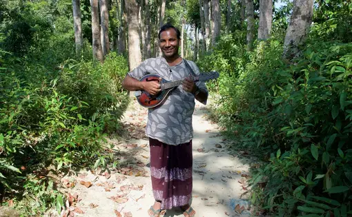 Soyedul Amin used to play music at weddings in Myanmar. He fled after being beaten and imprisoned. Image by Sasha Ingber. Bangladesh, 2019.