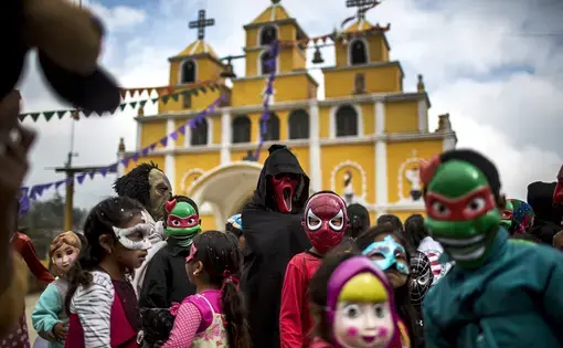 Primary school students from Bulej celebrate the carnival on March 5, in front of the church of San Mateo Apóstol. Image by Simone Dalmasso. Guatemala , 2019