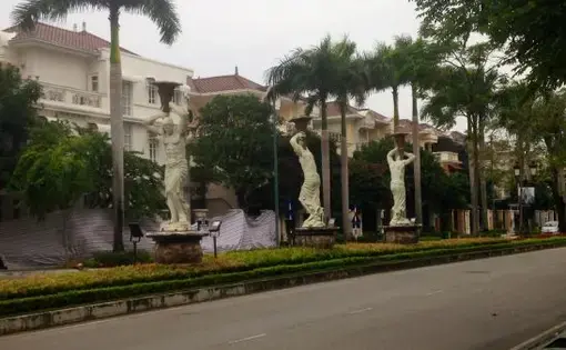 Statues of Greek gods on a tree lined road in Ciputra International City, in Hanoi’s Tay Ho district. Image by Claire Provost. Vietnam, 2015. Media file: ciputra_sculptures.jpg
