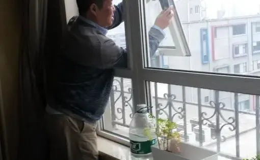 Zou Yi takes a photo of Beijing's air from the same window every day. He shares the images on social media, and compiles them into blue-and-grey checkerboard grids, turning pollution into art. Image by Beth Gardiner. China, 2017.