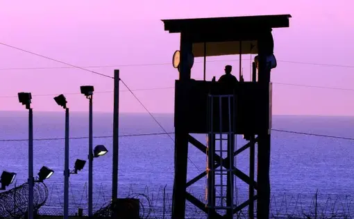 A watchtower at the Guantánamo Bay prison camp at dusk. Image by Gino Reyes. Cuba, 2011.