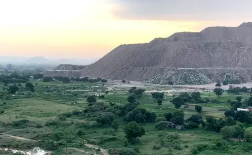 Decades of mining has changed the landscape of what was once a forested area of Madhya Pradesh, in central India. Electricity producer THDC India Limited plans to build another opencast mine, like the one pictured above, in Singrauli, India’s fourth most-critically polluted area. Image by Tish Sanghera. India, 2019.