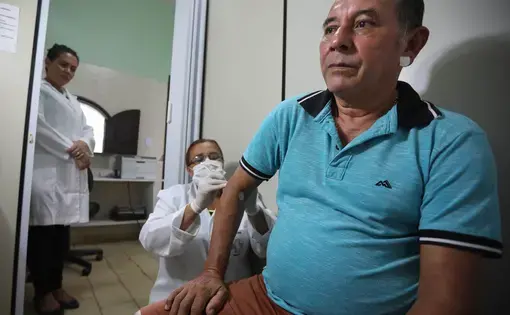 After more than a week of physical discomfort and skin irritation, Mariualdo do vale Monterio takes a Slit-skin Smear test at the Center of Diagnostics in Marituba. After the test, Maria Gonden, the nurse conducting the procedure, will search Monterio's DNA samples for mycobacterium leprae—the bacterium that causes leprosy. Image by Anton L. Delgado. Brazil, 2020.
