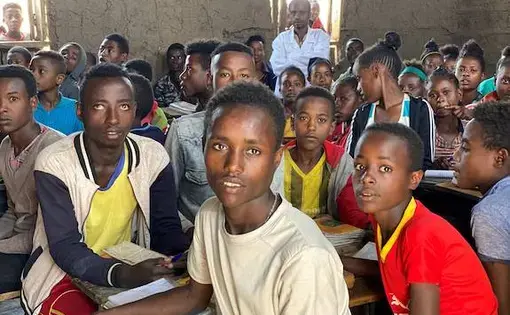 Hagirso at 21 in fourth grade classroom. Image by Anne Thurow. Ethiopia, 2019.