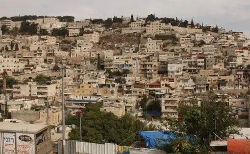 Settlers' houses in the jumbled Palestinian village of Silwan. Image by Uri Blau. Israel, 2015.