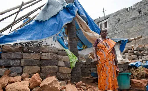 A neighbor of Mittireddi stands outside her home, which was destroyed during cyclone Hudhud but has not been rebuilt. Image by Zach Hollo. India, 2015. Media file: pc_23.jpg