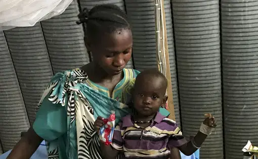 A woman with her child in the International Medical Corps hospital in Juba, South Sudan. Image by Jane Ferguson. South Sudan, 2017.
