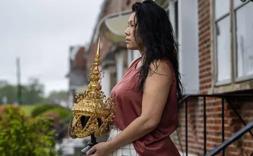 Catzie Vilayphonh is photographed holding a Laos folk crown near her home in Philadelphia, Pa. Friday, May 22, 2020. Vilayphonh is a poet who runs the community arts group Laos in the House. Image by Jose F. Moreno / The Philadelphia Inquirer. United States, 2020.