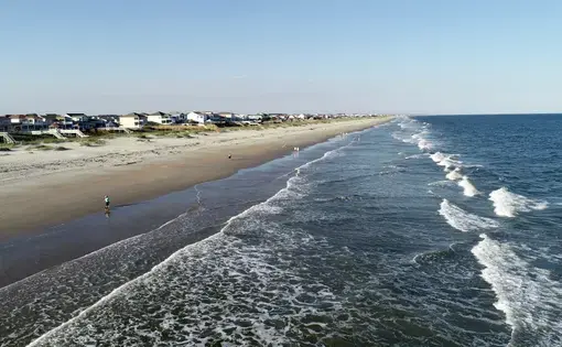 Aggressive waves at Ocean Isle Beach on a spring day. Image by Lewis Directed Films / Shutterstock. United States, undated.