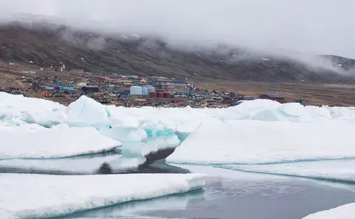 Qaanaaq, in North Greenland is the world's northernmost naturally inhabited town. It has found itself among the first casualties in the battle against climate change. Image by Anna Filipova. Greenland, 2019.