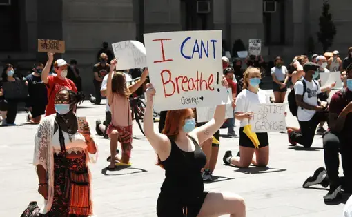 Hundreds of Philadelphians kneel in protest of system police violence and other forms of systemic racism in memory of George Floyd and other victims modern-day lynching at City Hall in Philadelphia, PA, on May 30, 2020. Image by Cory Clark/NurPhoto via Getty Images. United States, 2020.