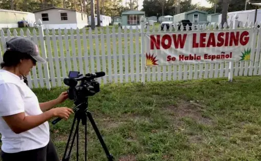 Community journalist Yolanda House films her short-documentary “Mi Casita,” which tells the story of a family and their struggle to stay in their home after Hurricane Florence. Image courtesy of Working Narratives. United States, undated.