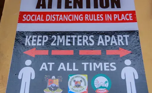 A poster on social distancing in a school in Lagos. Image by Oluwafemi Dawodu / Shutterstock. Nigeria, 2020.