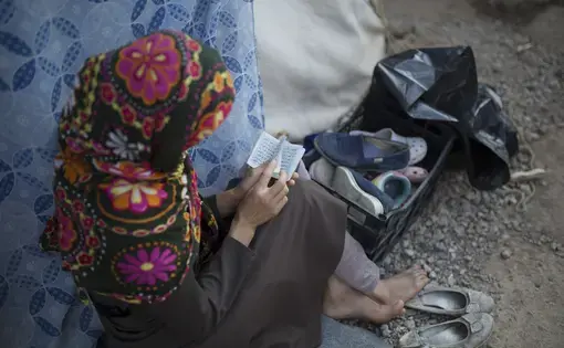 Woman reading Koran