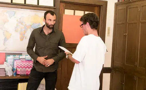 RJ Reynolds High School student Hill Douglas asks Pulitzer Center grantee Jason Motlagh about his reporting on the textiles industry in Bangladesh as part of Weaving Connections, a documentary filmmaking program developed as part of Pulitzer Center's NewsArts initiative. Image by Fareed Mostoufi. United States, 2017.