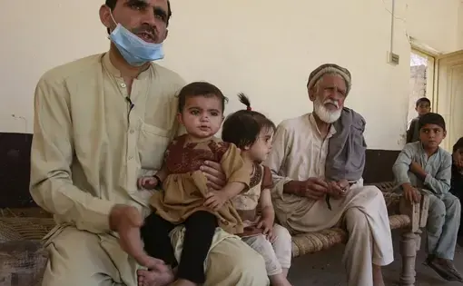 In this May 6, 2020 photo, Tariq Nawaz holds his 10-month-old baby daughter Tuba who suffers from polio, in Suleiman Khel, Pakistan. For millions of people like Nawaz who live in poor and troubled regions of the world, the novel coronavirus is only the latest epidemic. They already face a plethora of fatal and crippling infectious diseases: polio, Ebola, cholera, dengue, tuberculosis and malaria, to name a few. The diseases are made worse by chronic poverty that leads to malnutrition and violence that…