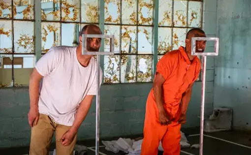 Actors Lawrence Redecker and Carlos Aguirre performing The BOX on Alcatraz Island, 2019. These performances were produced in partnership with the Pulitzer Center. Image by Robert Gumpert. United States, 2019.