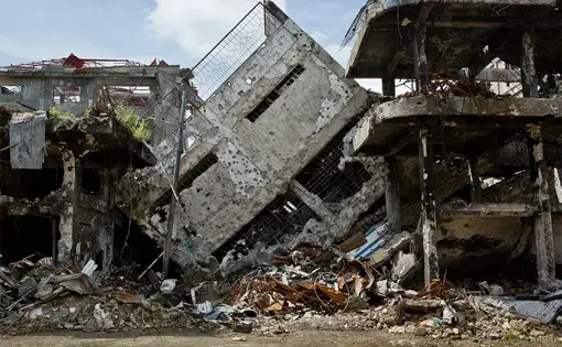 ISIS fighters have left damage in their wake while trying to take hold of cities in the Philippines. Image by&nbsp;David Maurice Smith. Philippines, 2018.