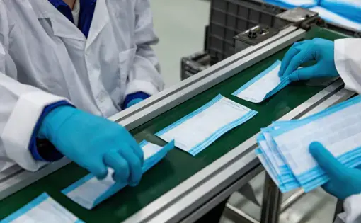 As the novel pneumoconiosis coronavirus spreads worldwide, medical mask automation machines are in continuous 24-hour production to prepare for the outbreak. Image by InkheartX / Shutterstock.com. Undated.