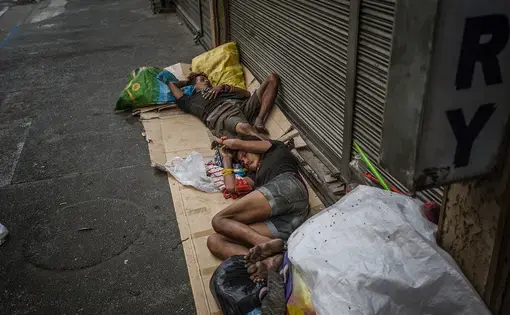 Many families sleep on Mabini Street of Malate, Manila, often suffering not only from poverty but substance abuse problems. By May 2016, a little over one month before the inauguration of Philippine President Rodrigo Duterte, extrajudicial killings have taken the lives of over 8,000 Filipinos. As of June 2017, almost all the homeless who sleep on Mabini Street are no longer there, their whereabouts unknown. Image by James Whitlow Delano. Philippines, 2016. Many families sleep on Mabini Street of Malate, Manila, often suffering not only from poverty but substance abuse problems. By May 2016, a little over one month before the inauguration of Philippine President Rodrigo Duterte, extrajudicial killings have taken the lives of over 8,000 Filipinos. As of June 2017, almost all the homeless who sleep on Mabini Street are no longer there, their whereabouts unknown. Image by James Whitlow Delano. Philippines, 2016.
