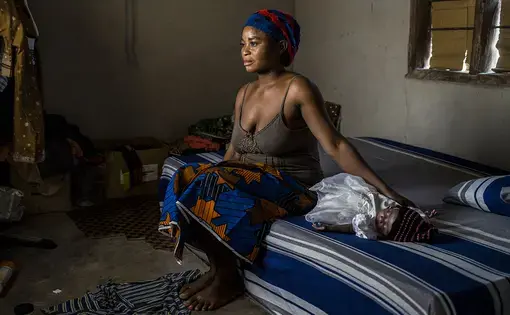 Rose Kough and her 6-week-old baby received antiretroviral drugs to prevent mother-to-child transmission of HIV. Image by Misha Friedman. Nigeria, 2018. 