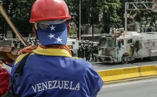 Still image from Nadja Drost and Bruno Federico's PBS NewsHour video "Dire conditions drive growing anti-government opposition in Venezuela." Venezuela, 2017.