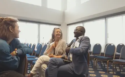 Teaching Partners Alexandra and Laura Marie discuss the panel with conference participant. Image by Dominique Green. Washington, D.C., 2019.