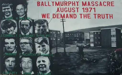 A memorial mural to the victims of the Ballymurphy massacre that reads, "The Ballymurphy Massacre August 1971 We demand the truth".