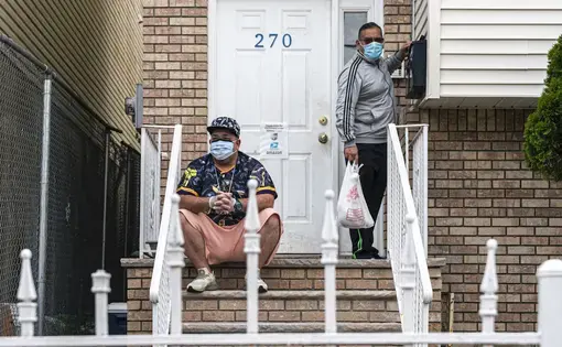 On the left, Mike Ruiz Rivera, a native of Ponce and a resident of Newark, New Jersey, is a 42-year-old man who survived COVID-19 after more than half a month hospitalized. Image by by Hiram Alejandro Durán / Center for Investigative Journalism. United States, 2020.